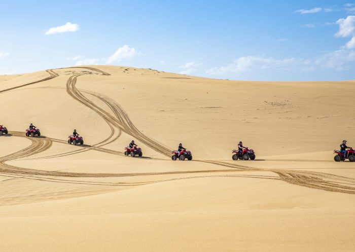 Sand Dune Adventures, Port Stephens Small group enjoying an Aboriginal cultural tour on quad bikes with Sand Dune Adventures, Port Stephens