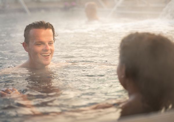 Couple enjoying a relaxing visit to the Moree Artesian Aquatic Centre, Moree