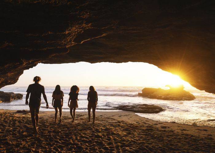 Caves Beach, Lake Macquarie Friends enjoying a warm sunrise from Caves Beach, Lake Macquarie in the North Coast