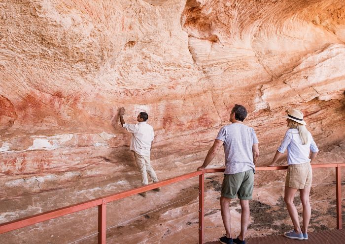 Mutawintji National Park, Mutawintji Mutawintji National Park tour guide Keanu Bates showing visitors Aboriginal rock art at Mutawintji Historic Site, Mutawintji