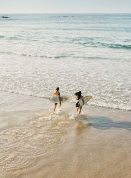 Couple enjoying a morning surf, Birubi Beach, Port Stephens