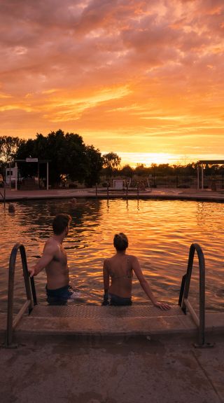 Couple enjoying a visit to the Lightning Ridge Bore Baths, Lightning Ridge
