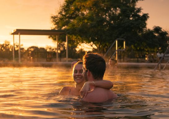 Couple enjoying a visit to the Lightning Ridge Bore Baths, Lightning Ridge