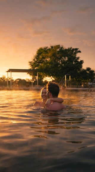 Couple enjoying a visit to the Lightning Ridge Bore Baths, Lightning Ridge