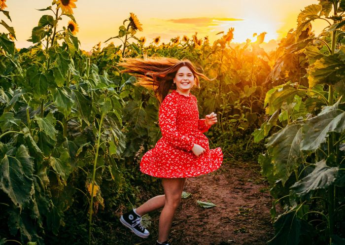 Hunter Valley Sunflowers, Hunter Valley - Credit: Hunter Valley Sunflowers Girl running through a field of sunflowers at Hunter Valley Sunflowers, Hunter Valley