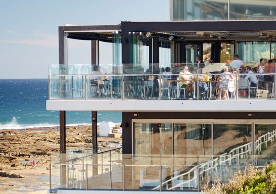 People enjoying food and drink with ocean views, Merewether Surfhouse, Newcastle