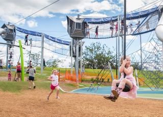 Kids playing on the equipment at Tamworth Regional Playground, Tamworth