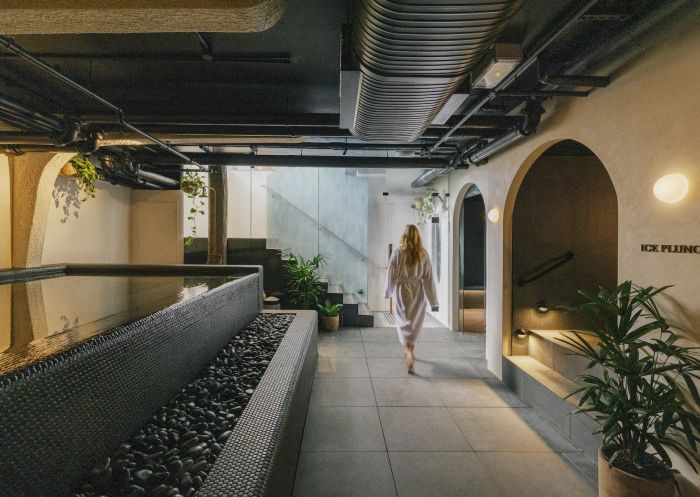 Navia Bathhouse, Byron Bay - Credit: Elise Hassey Woman walking, Navia Bathhouse, Byron Bay - Credit: Elise Hassey